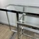Chrome metal and glass console from the 2000s.