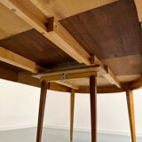 Round walnut Napoleon III extendable table with bronze top in good condition.