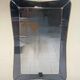 1950s double-thickness wall mirror with brass profile and supports.