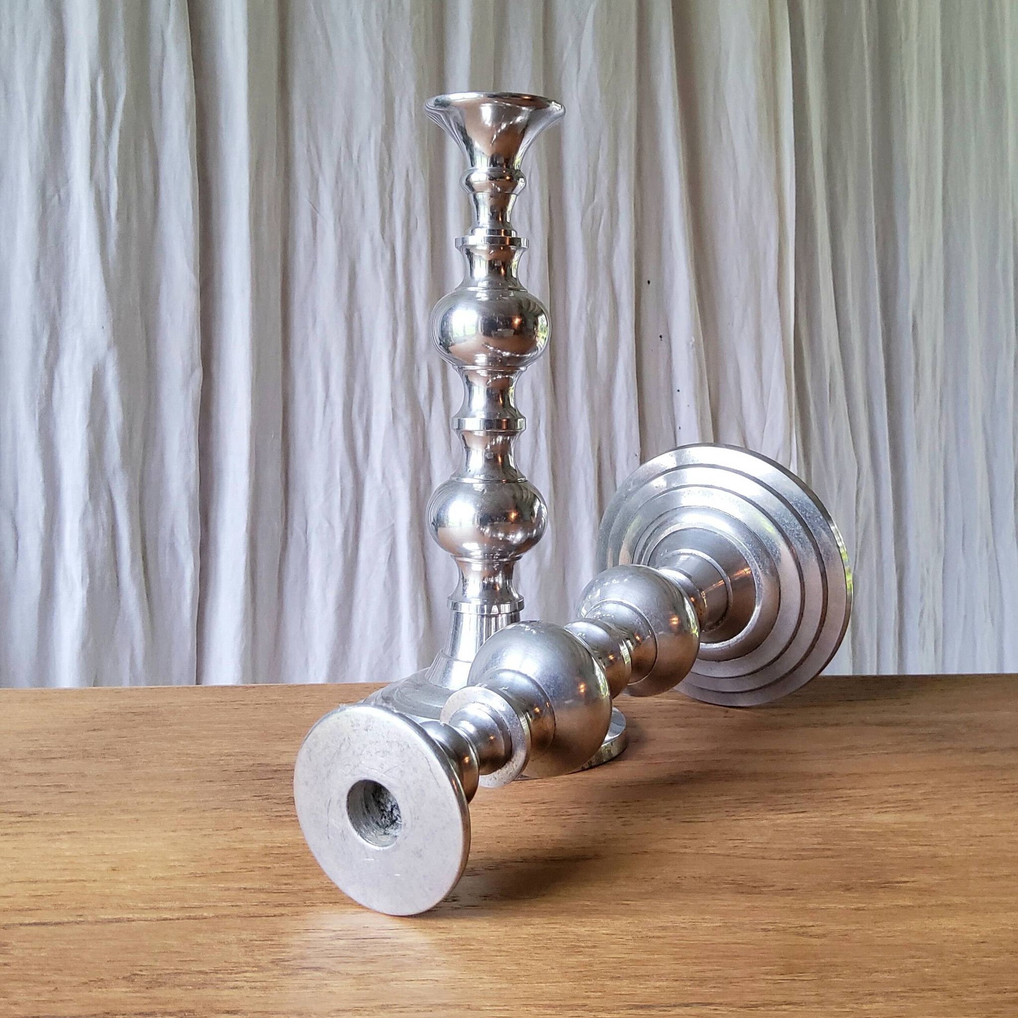 Pair of antique chrome metal candlesticks