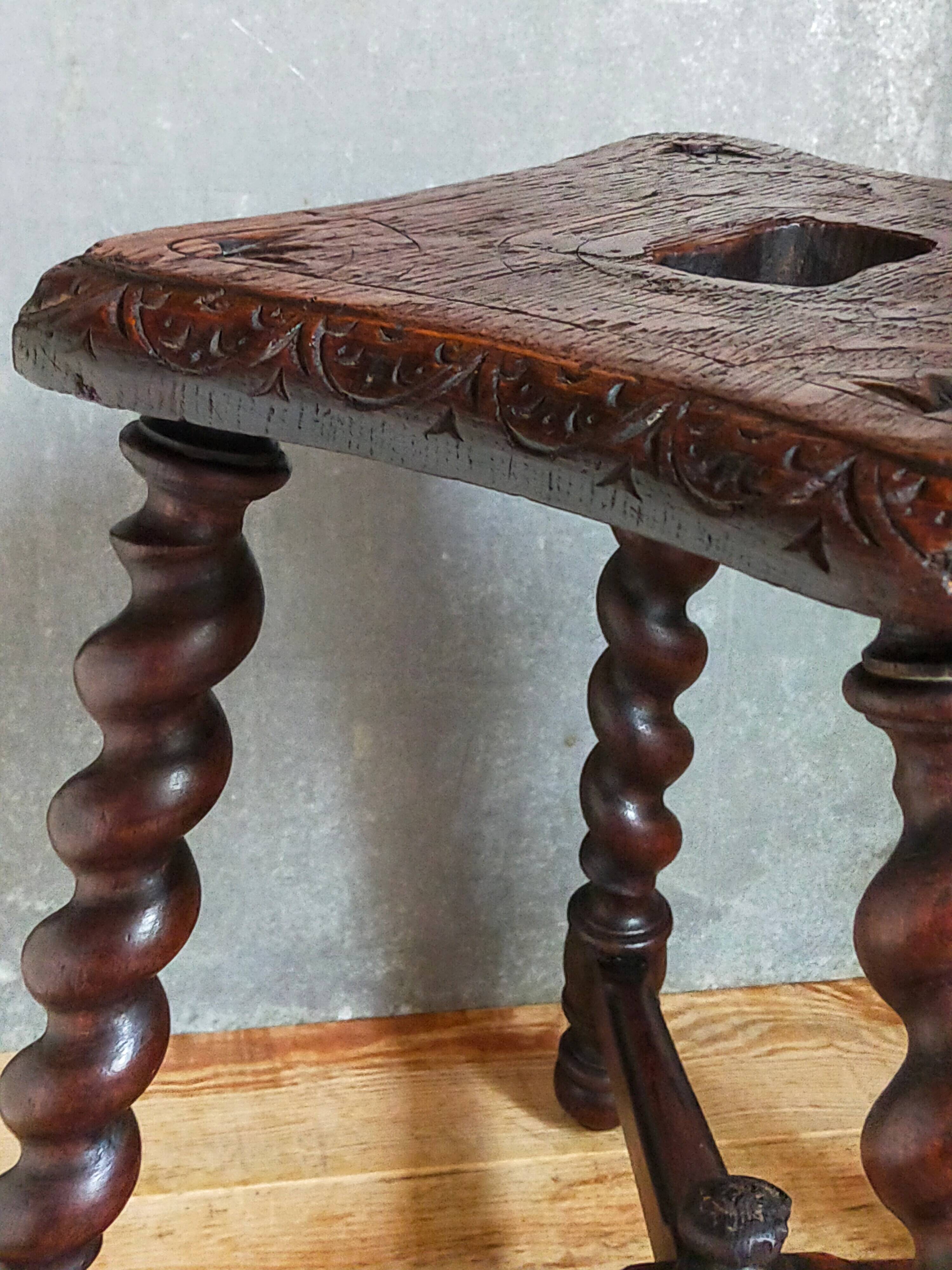 Antique stool in turned and carved solid wood