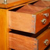 Victorian high chest of drawers in walnut with a bronze gallery.