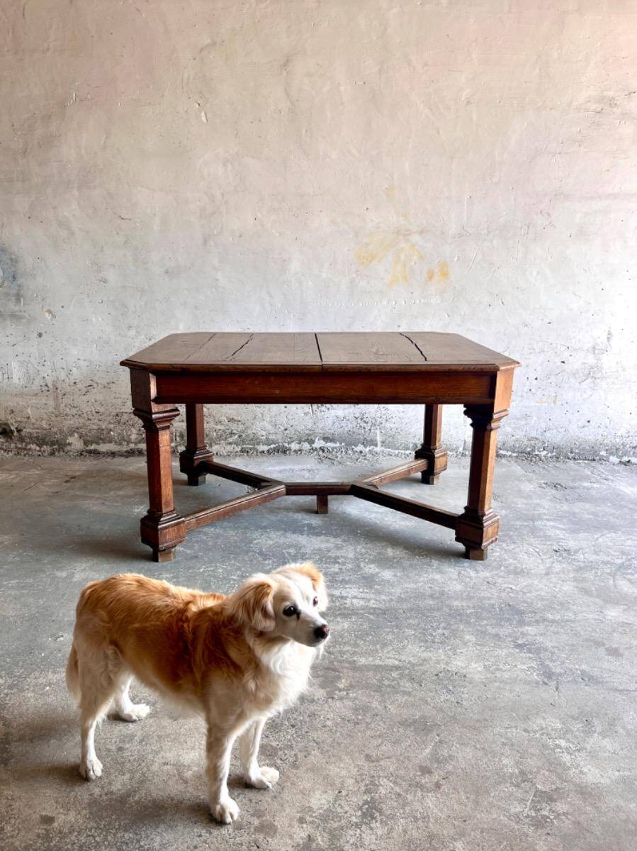 French dining table in Neo-Renaissance style with cross legs.