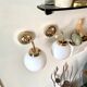 2 appliques en métal doré et opaline blanche