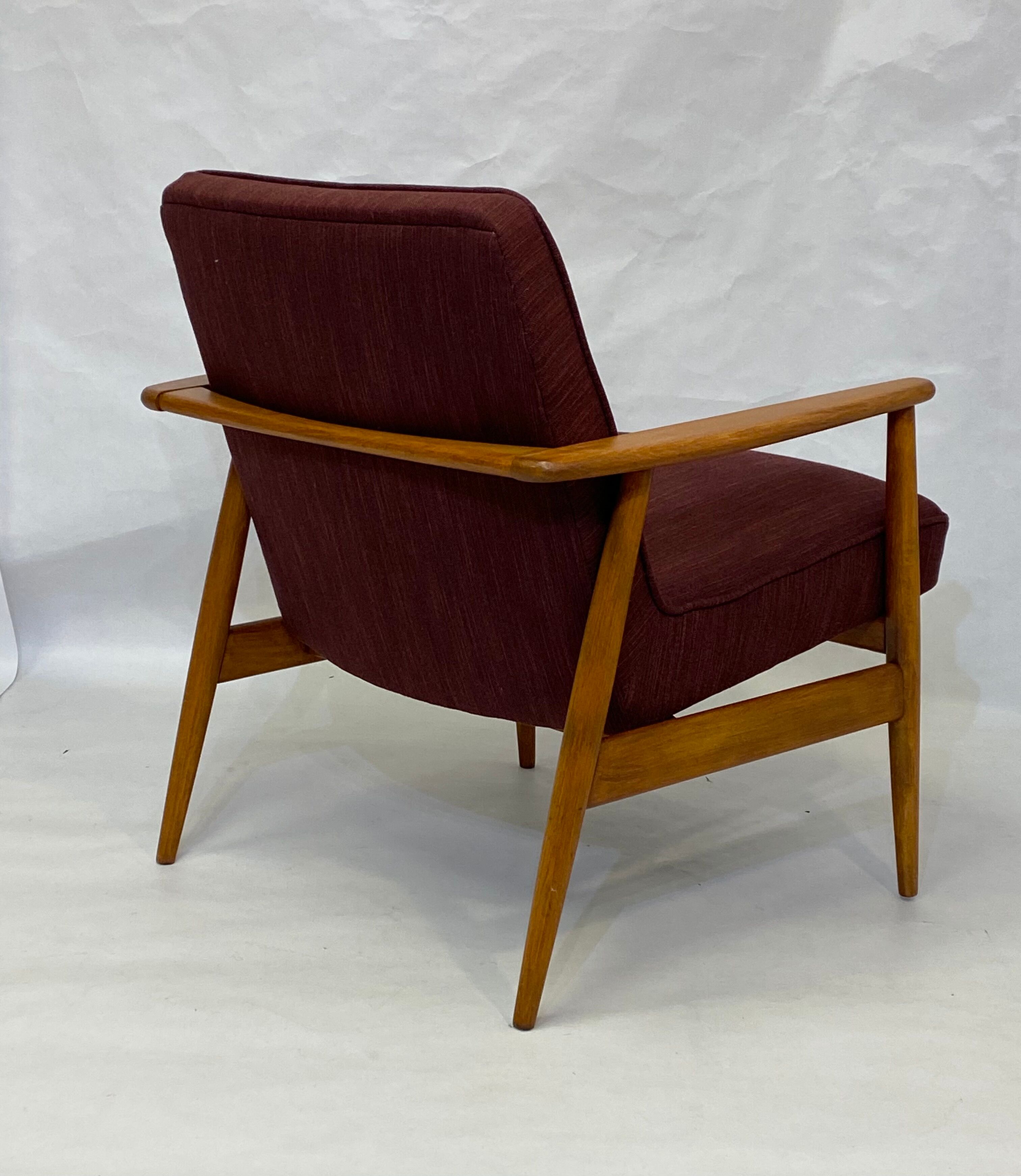 Chair created by Mr. Zieliski year 60 burgundy fabric.