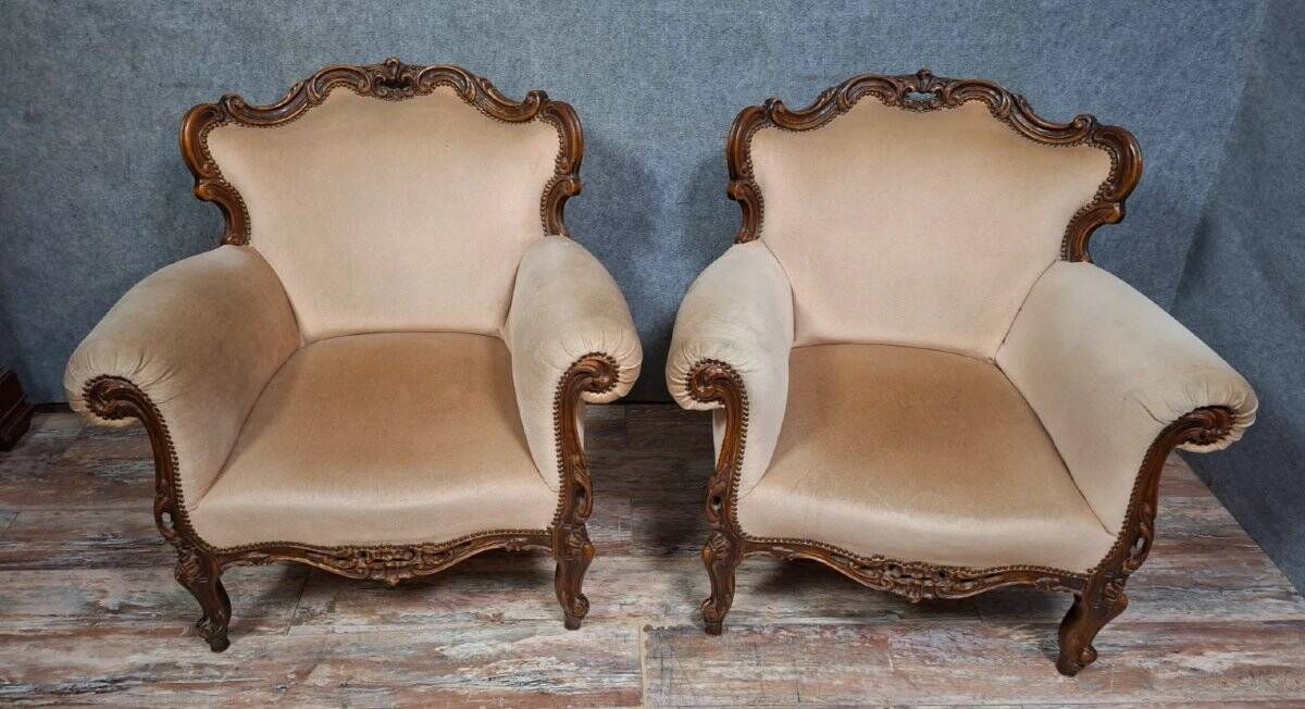 Pair of sculpted walnut armchairs – Louis XV style – 20th century