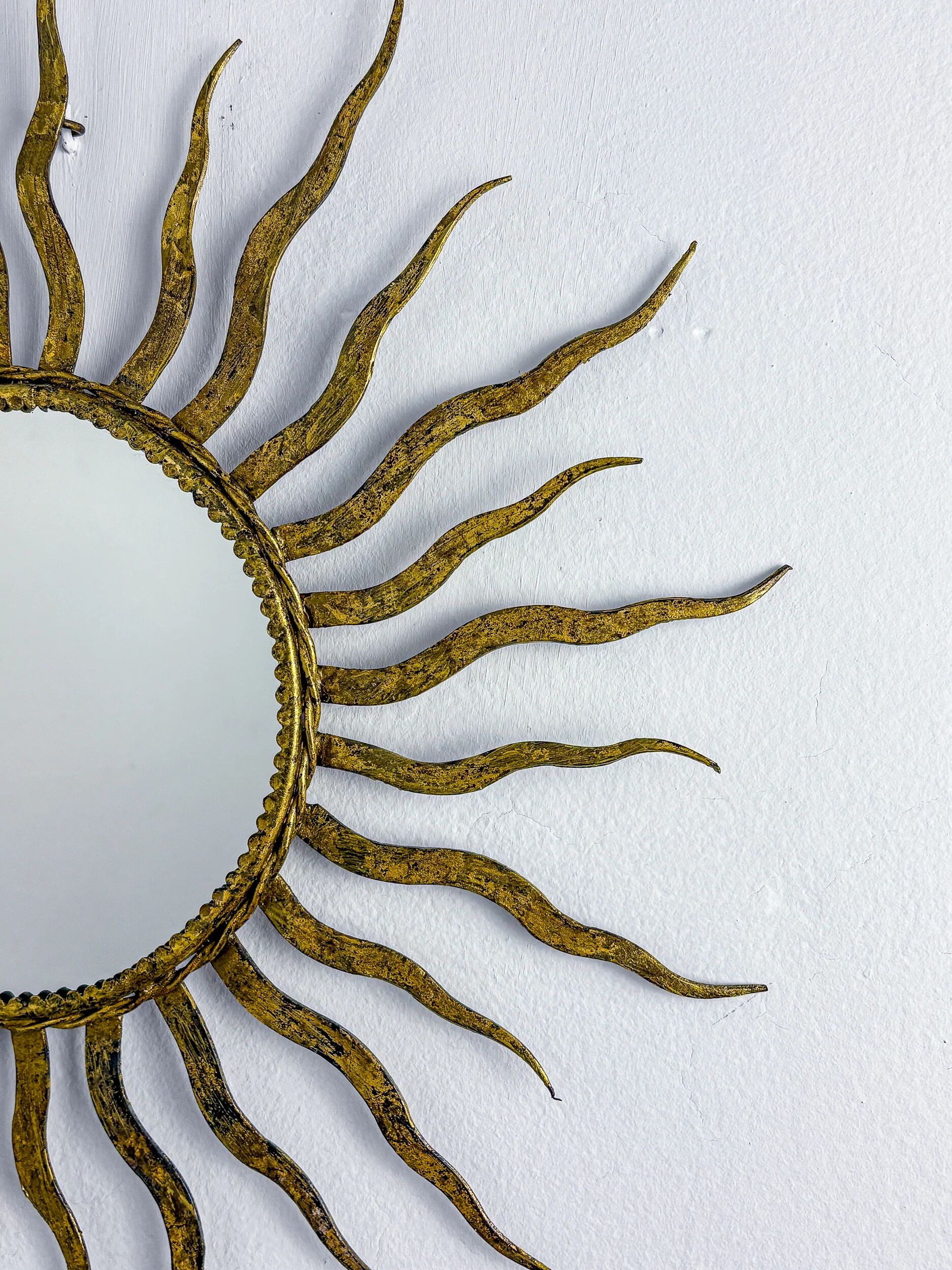 French sunburst starburst mirror in gilt iron, 1950s