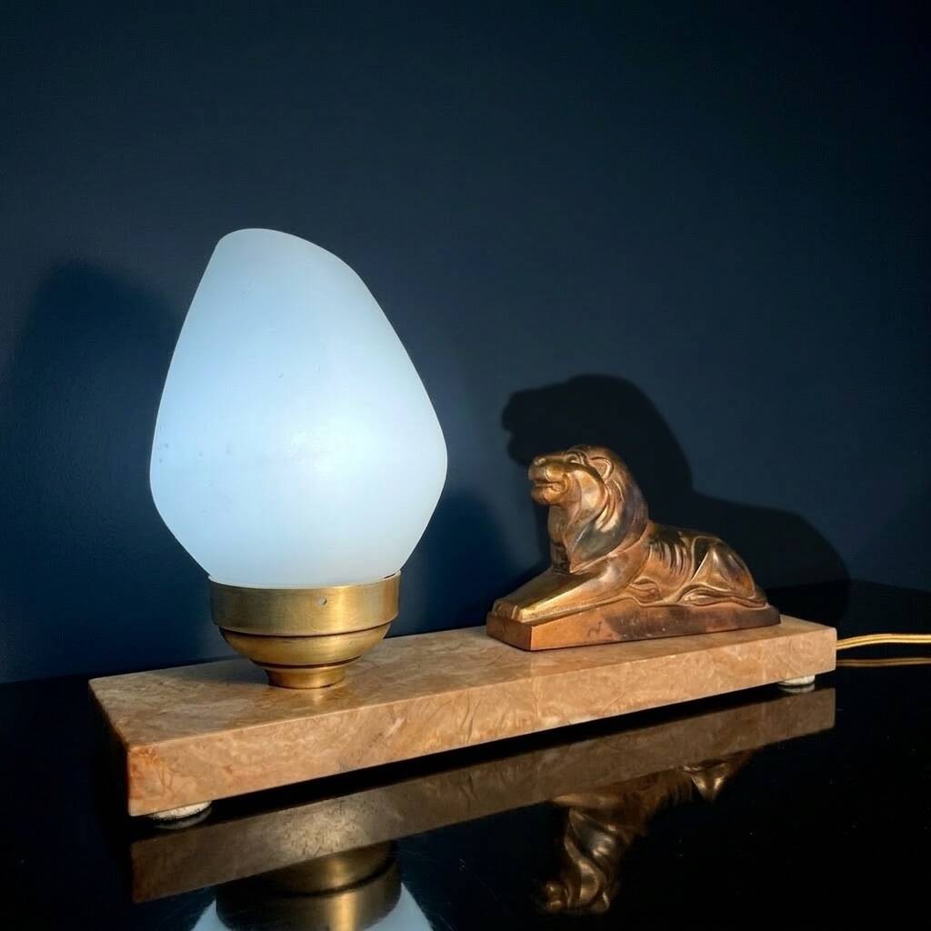 Art Deco lamp with marble, opaline globe & lion sculpture in spelter