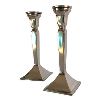 Pair of cast aluminum candle holders