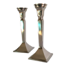 Pair of cast aluminum candle holders