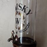 Vintage glass and wood whiskey bottle with pouring tap