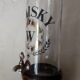 Vintage glass and wood whiskey bottle with pouring tap