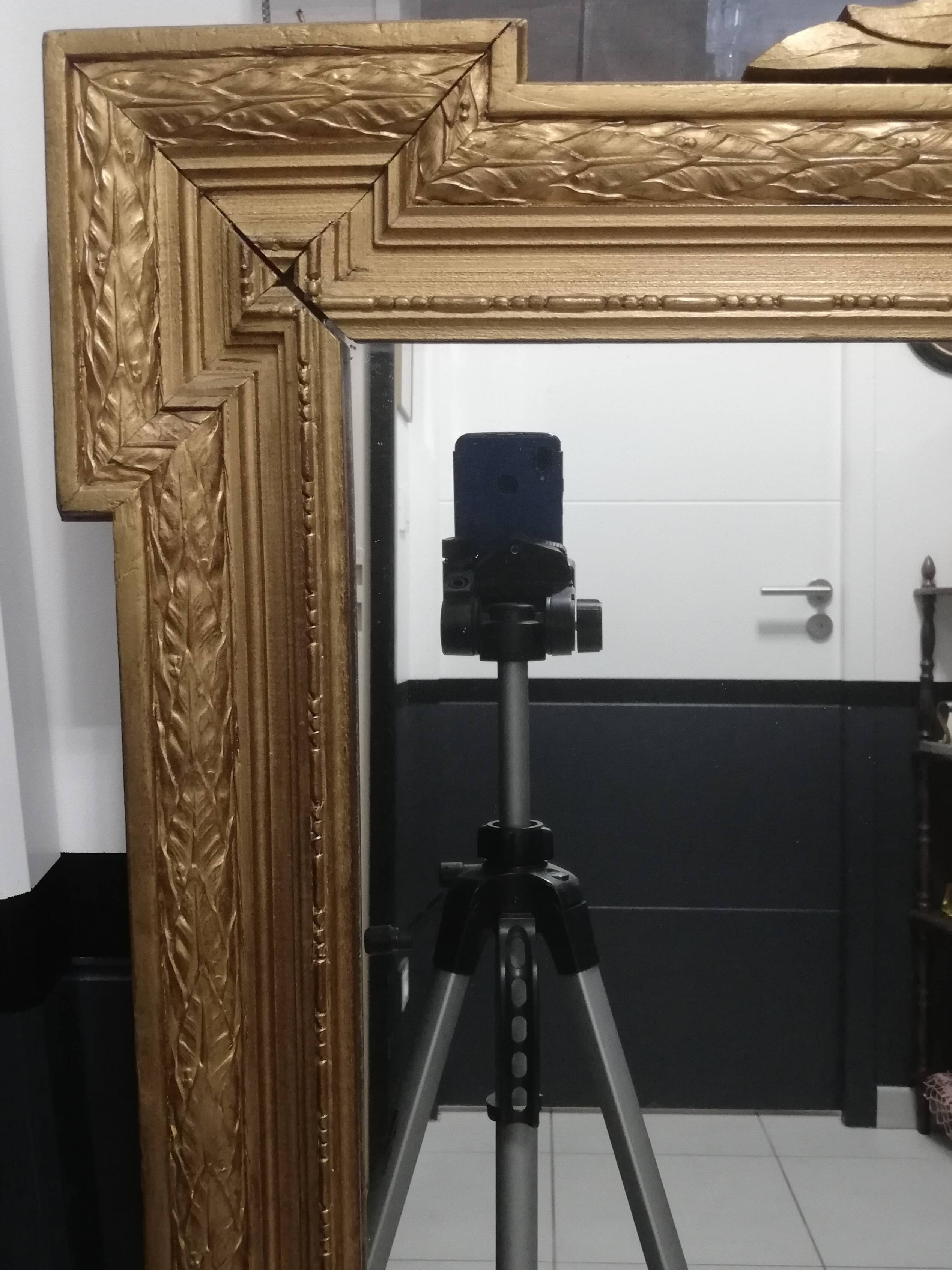 Carved wooden pediment mirror