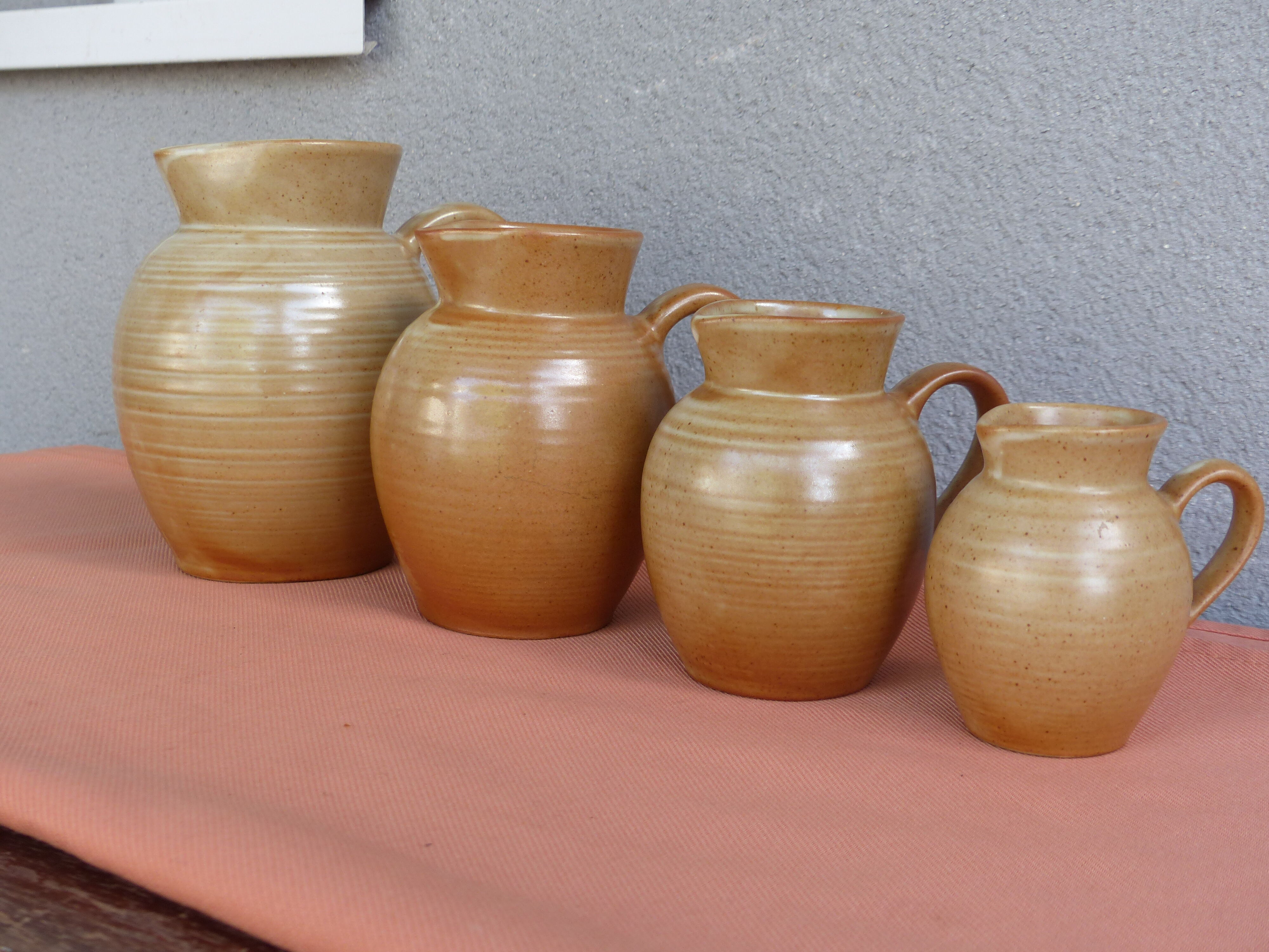 Set of 4 pitchers, CNP, Grès Village France.