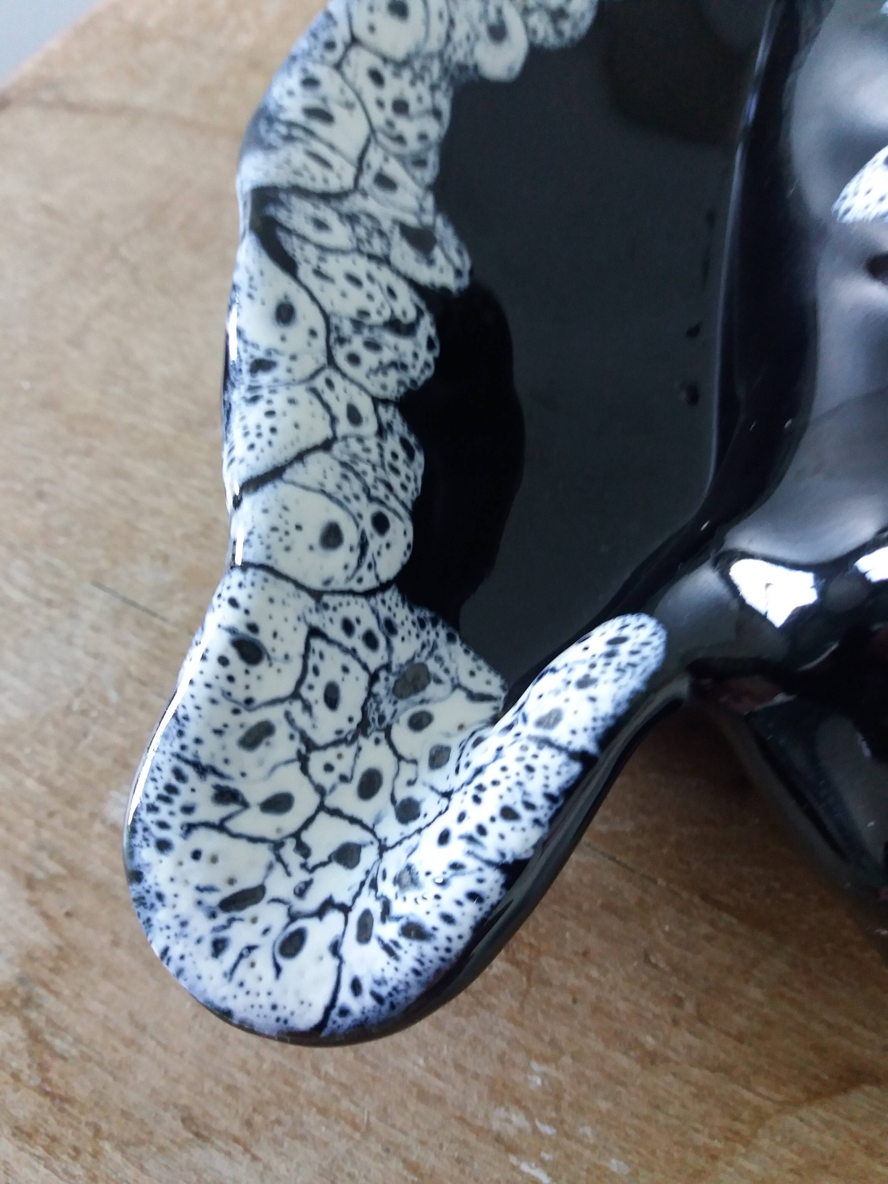 Black ceramic and foam shell ashtray