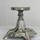 Candle holder with sculpted metal base, antique.