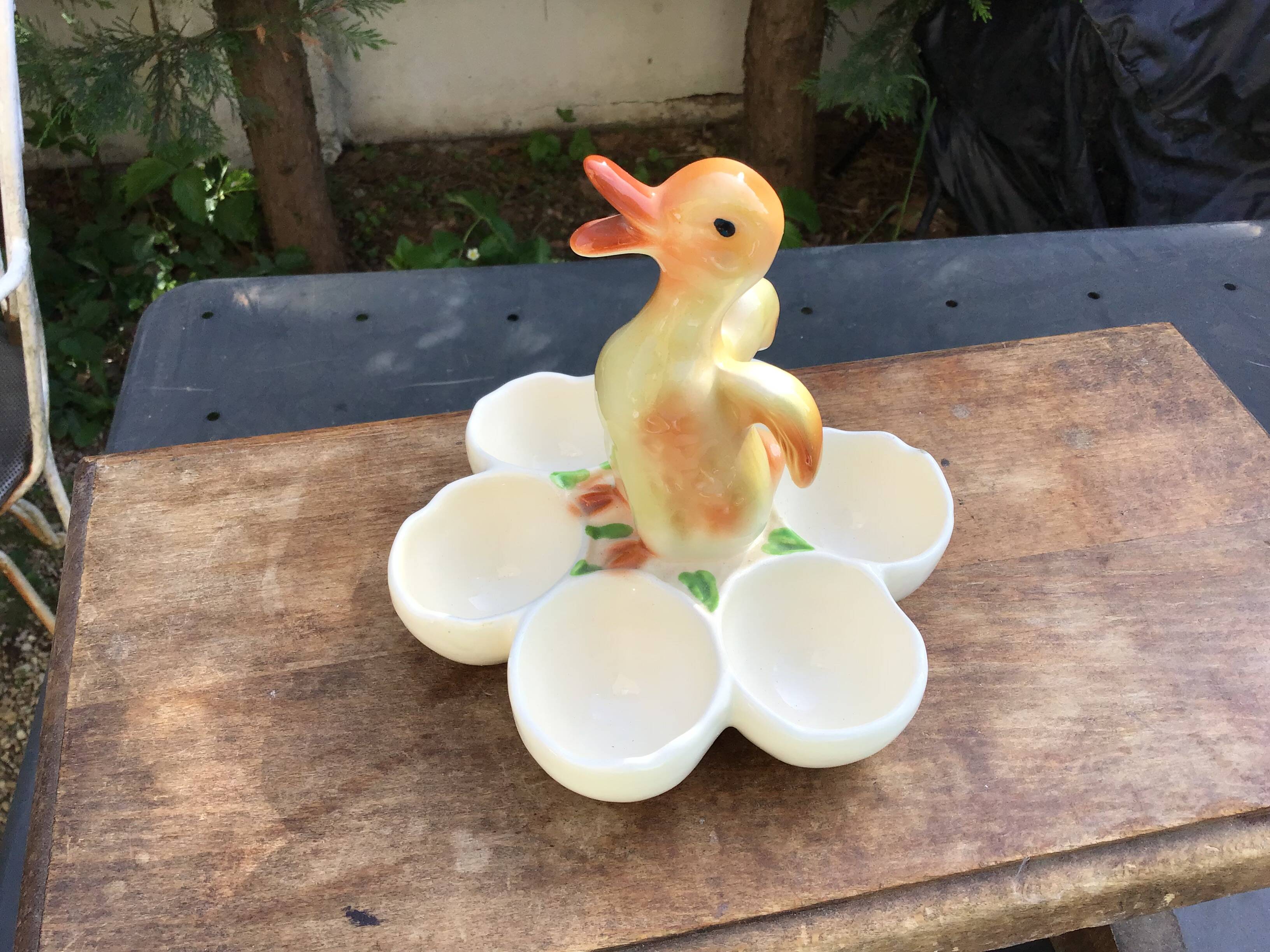 Egg cup with central chick decoration