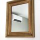 Antique mirror in gilded and copper wood