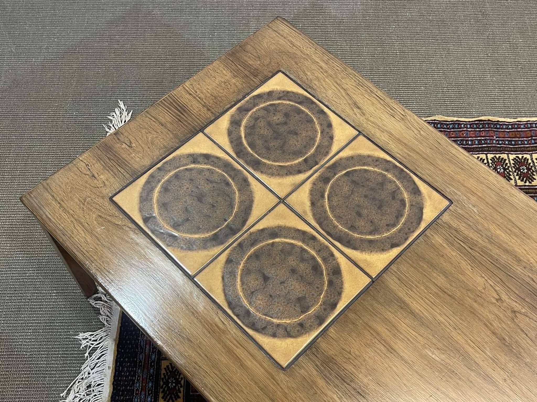 English coffee table in rosewood with tiled section from the 1970s.