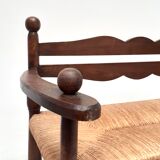 Vintage bench with wooden backrest and structure and mulched seat