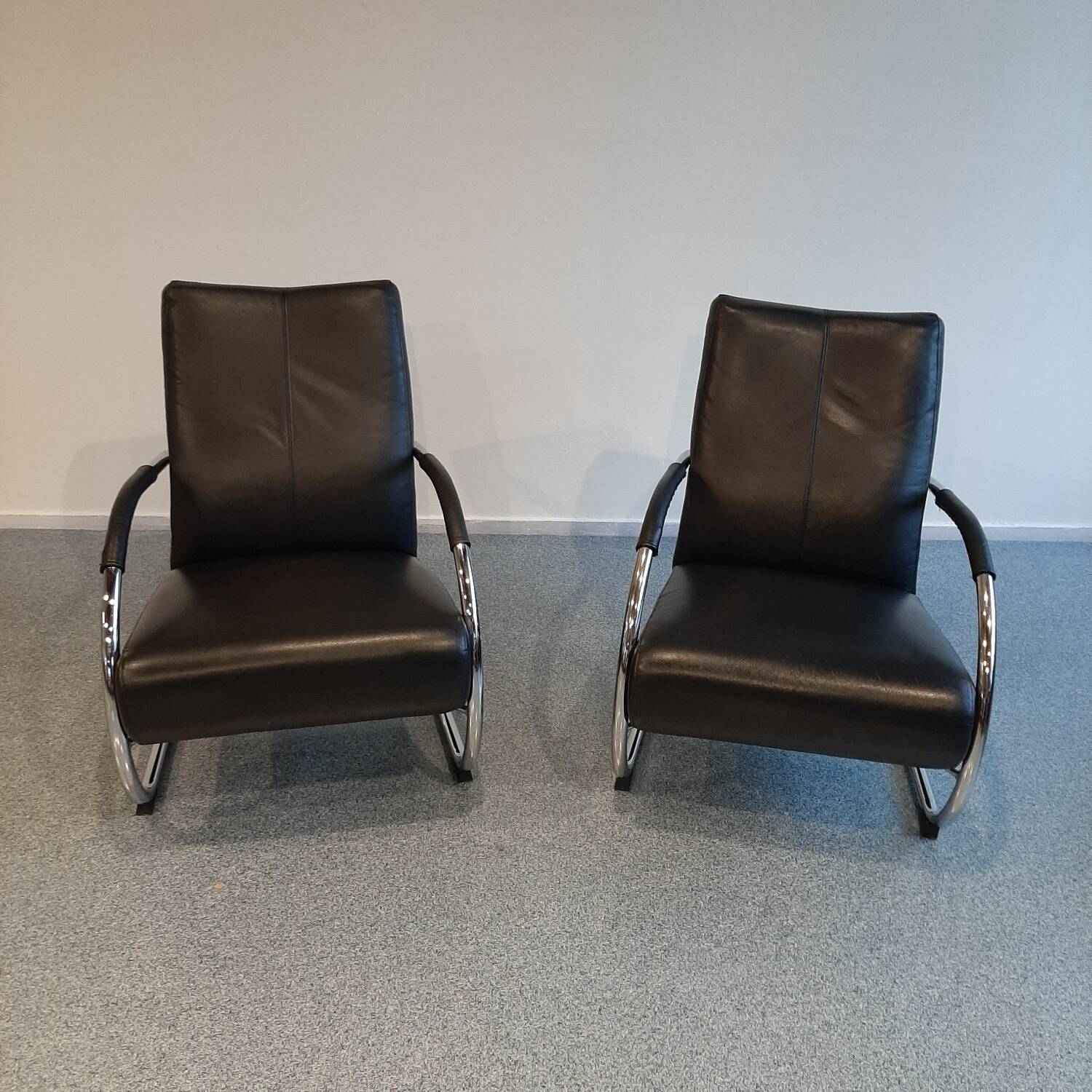 Pair of tubular armchairs