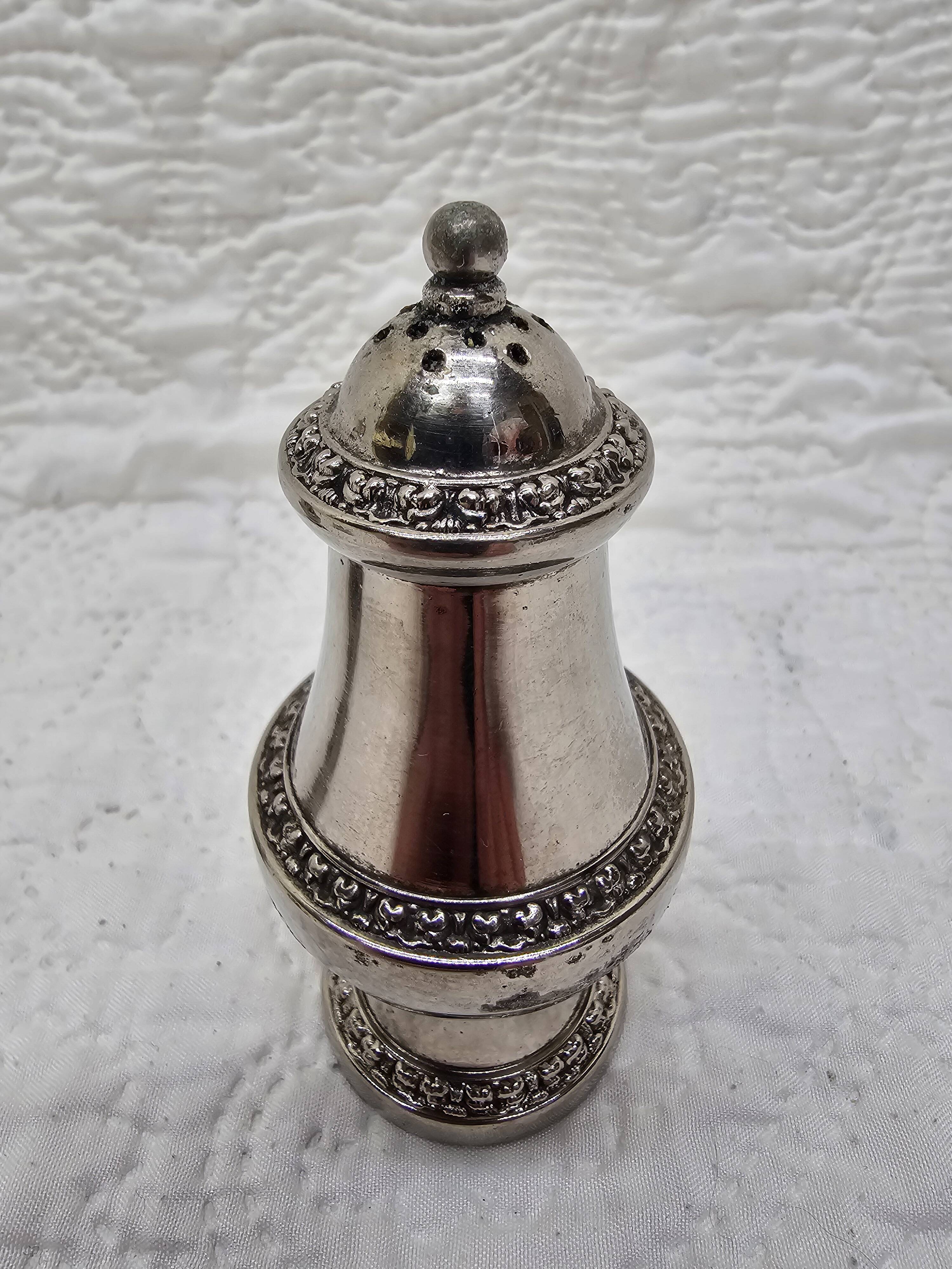 Silver-plated salt and pepper shakers and egg cups