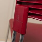 Red plastic-seat stacking chair with chrome frame by Paolo Favaretto for Assisa (Italy 1986) – vintage design
