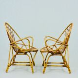 A pair of rattan chairs