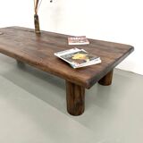 Modernist coffee table in solid elm, cylindrical pine base, 1970s.