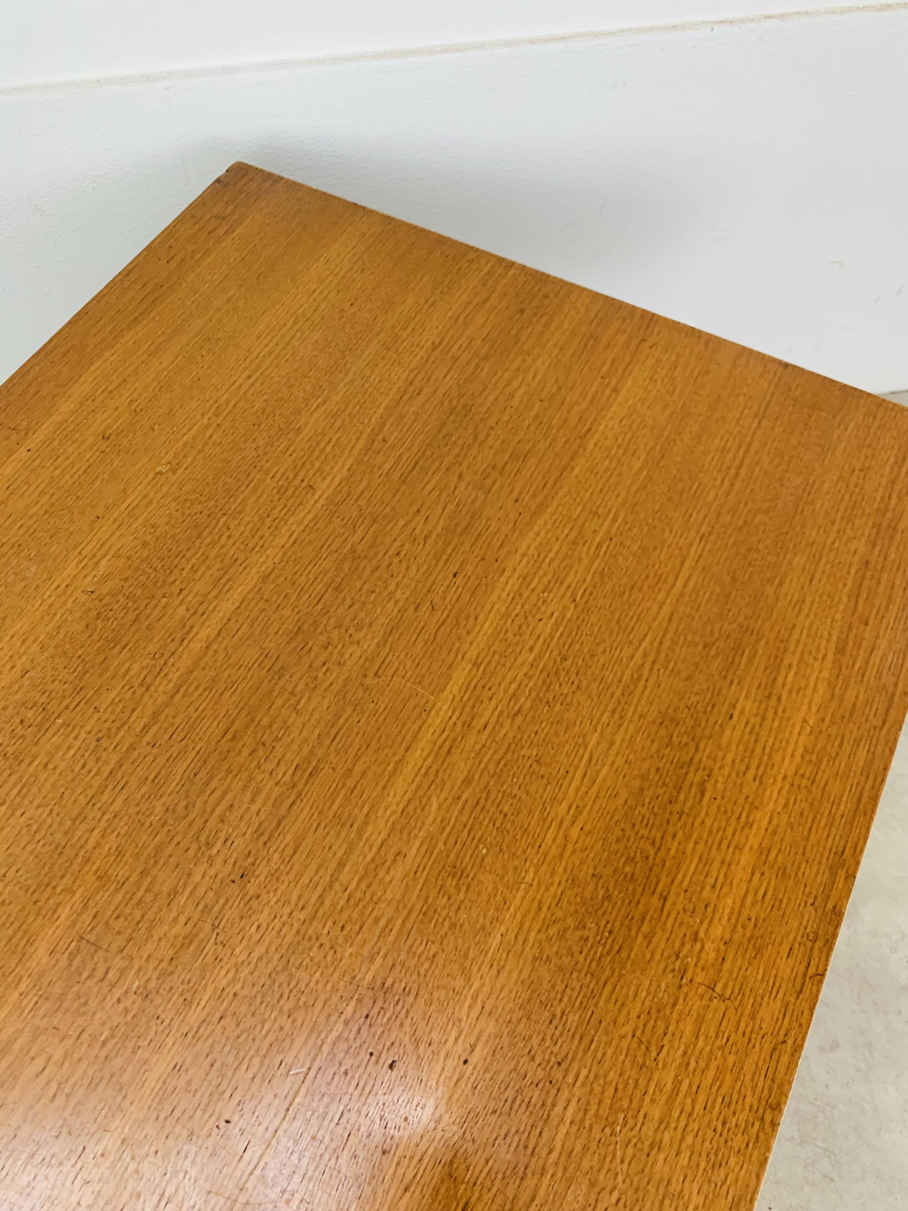 1950s modernist coffee table, wood and black metal.