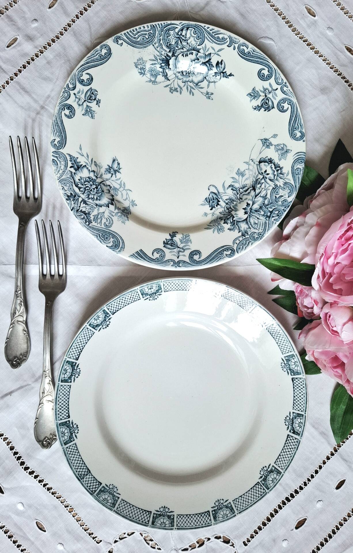 Old mismatched flat plates made of ironstone earthenware.