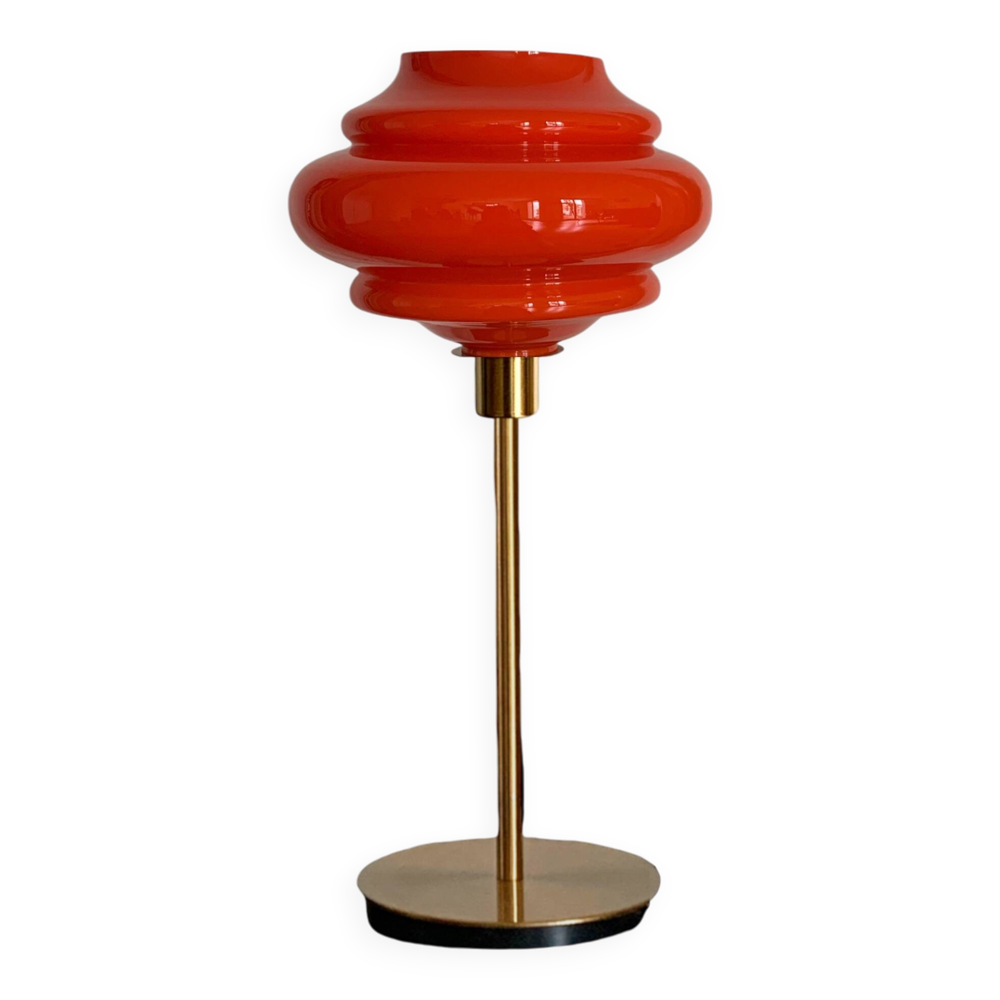 Table lamp with a vintage orange globe from an old pendant light