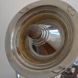 Ashtray and shelf on chrome metal stand.
