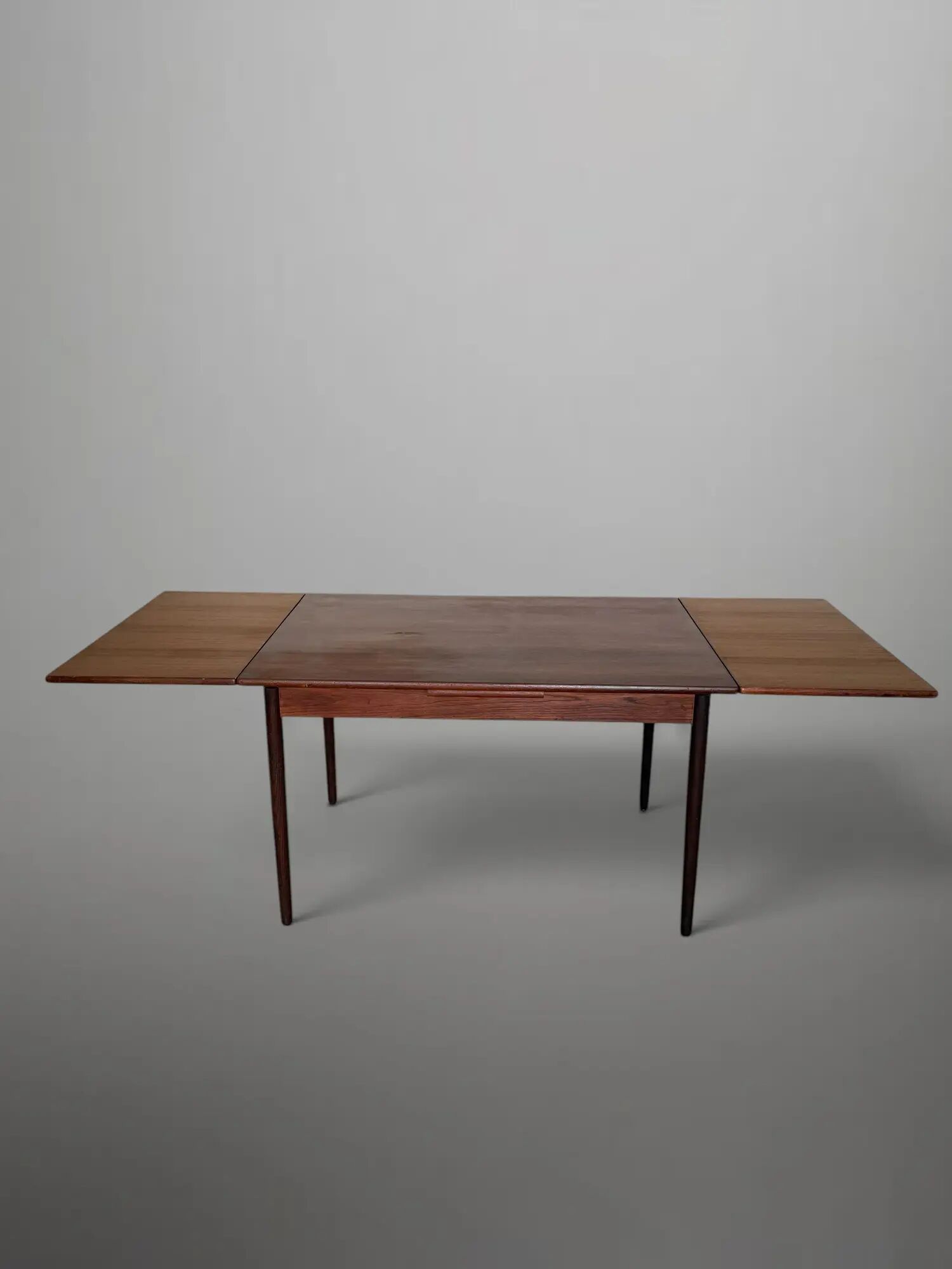 Scandinavian extendable dining table in teak