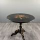 Napoleon III guéridon table in black lacquered wood with floral painted decoration, 19th century.