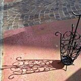 Antique wrought iron umbrella stand for entrance hall, vintage decor.