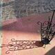 Antique wrought iron umbrella stand for entrance hall, vintage decor.
