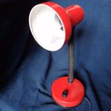 Articulated red desk lamp