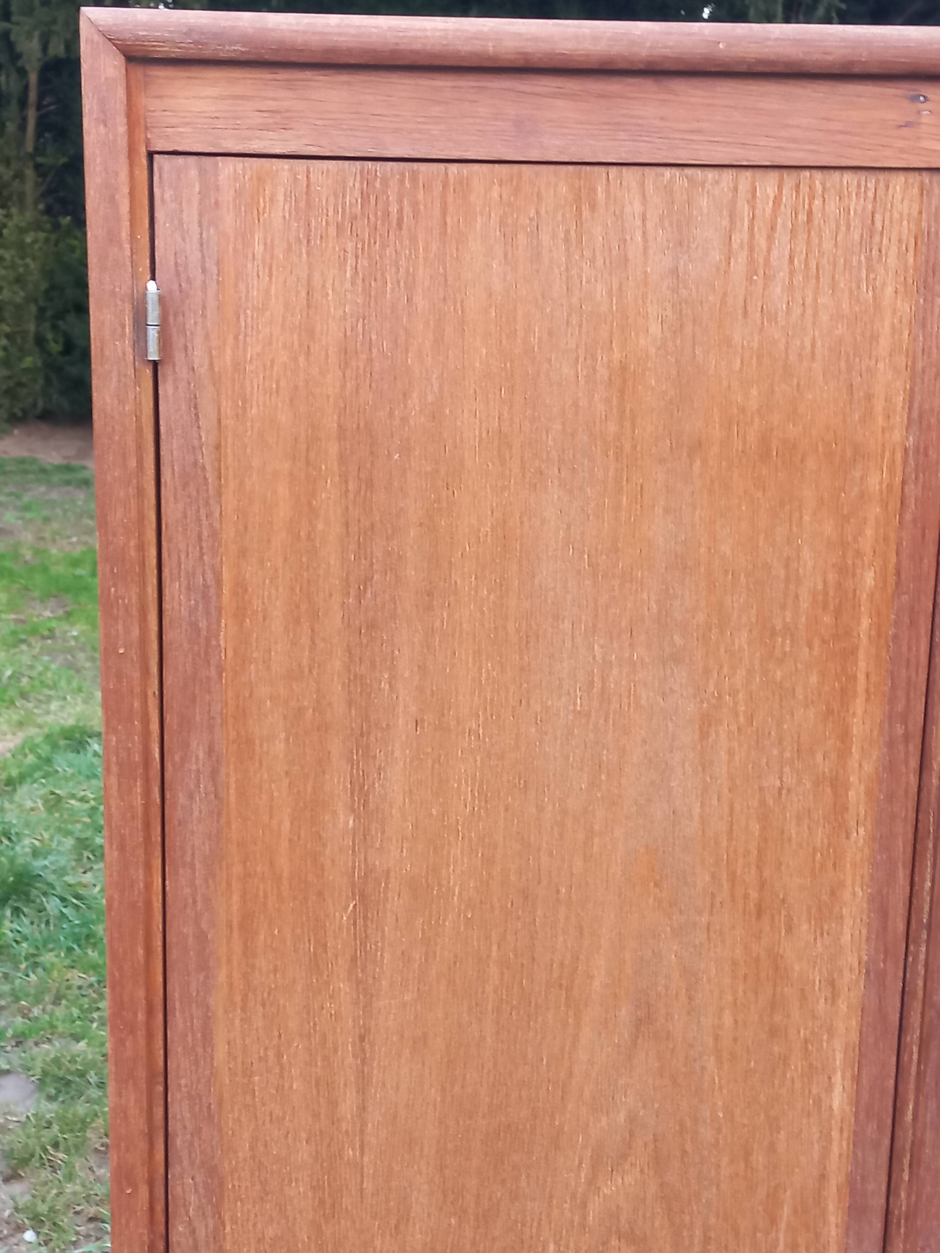 Vintage oak wardrobe with metal legs from the 1950s.