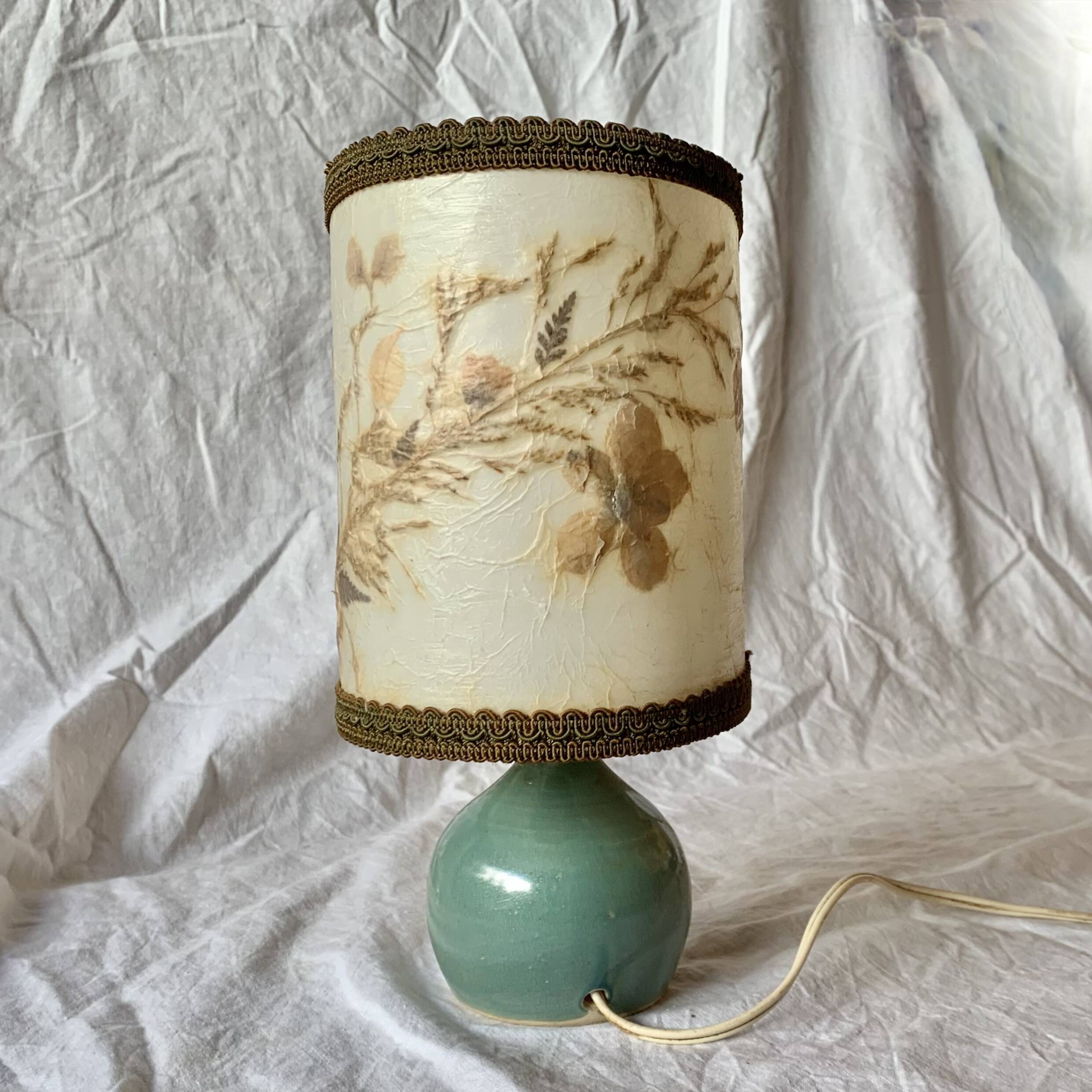 Old small green ceramic side lamp with dried flower lampshade