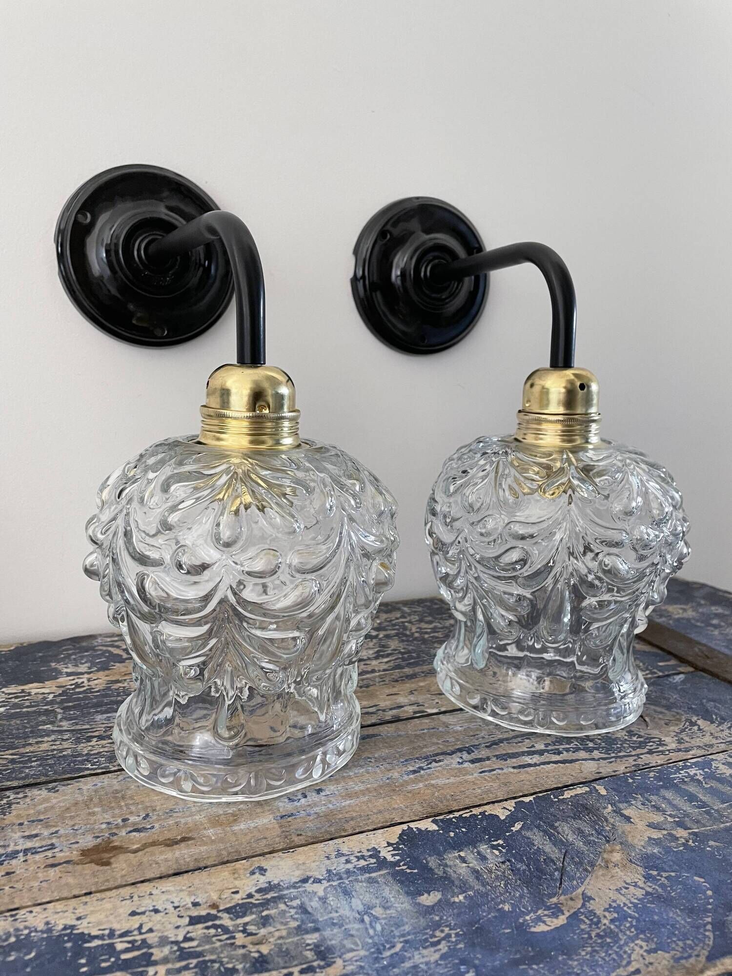 Pair of vintage electrified to nine-piece chiseled glass wall lamps