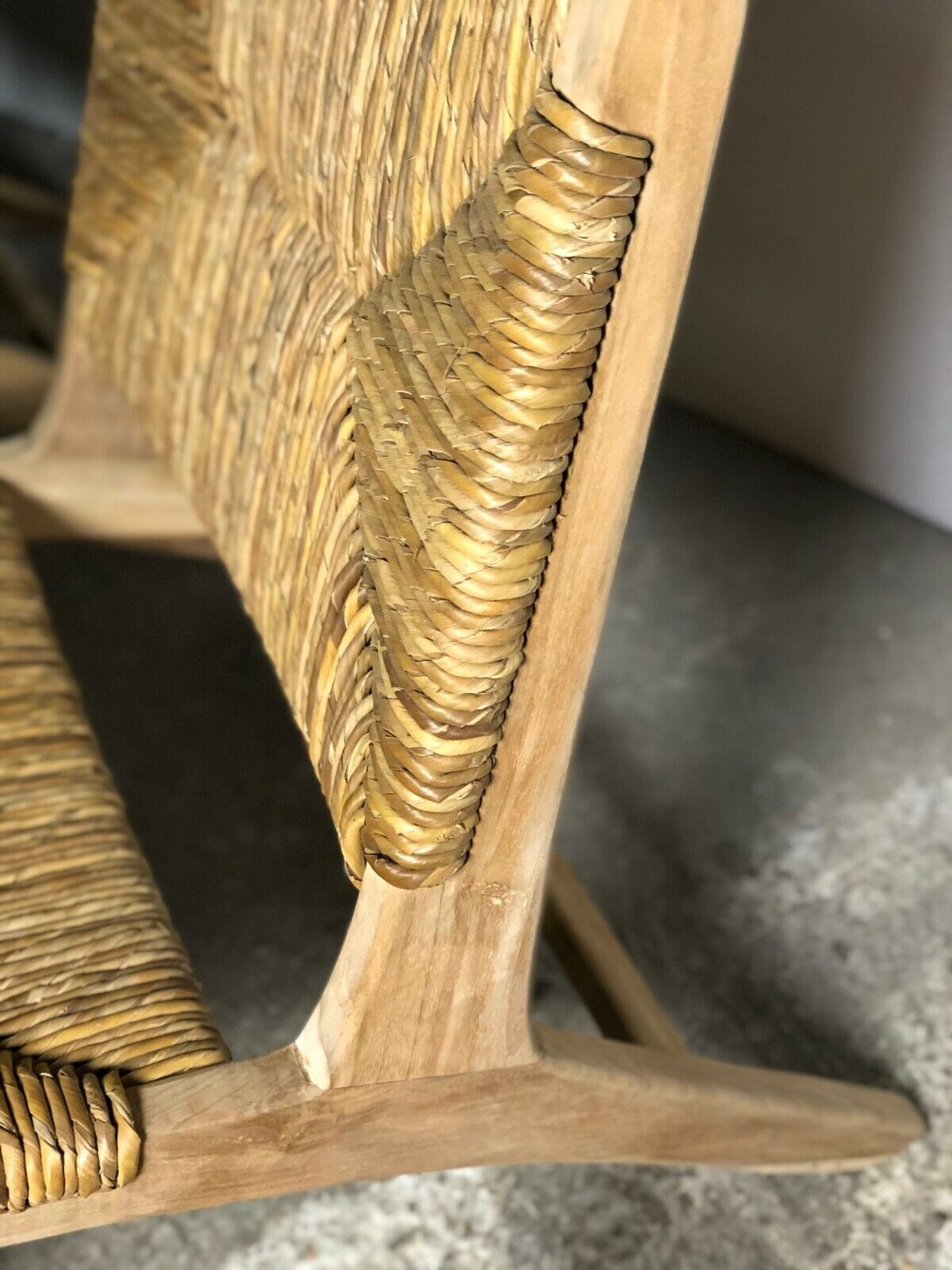 Low armchair in raw teak with seat and mulched backrest