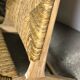 Low armchair in raw teak with seat and mulched backrest