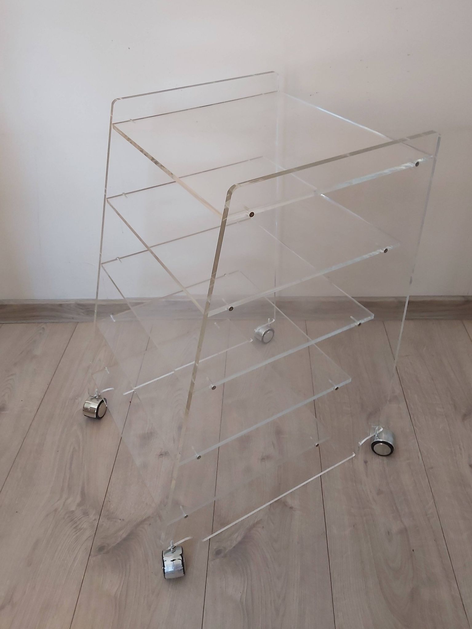 Lucite mobile shelf, 1970s.