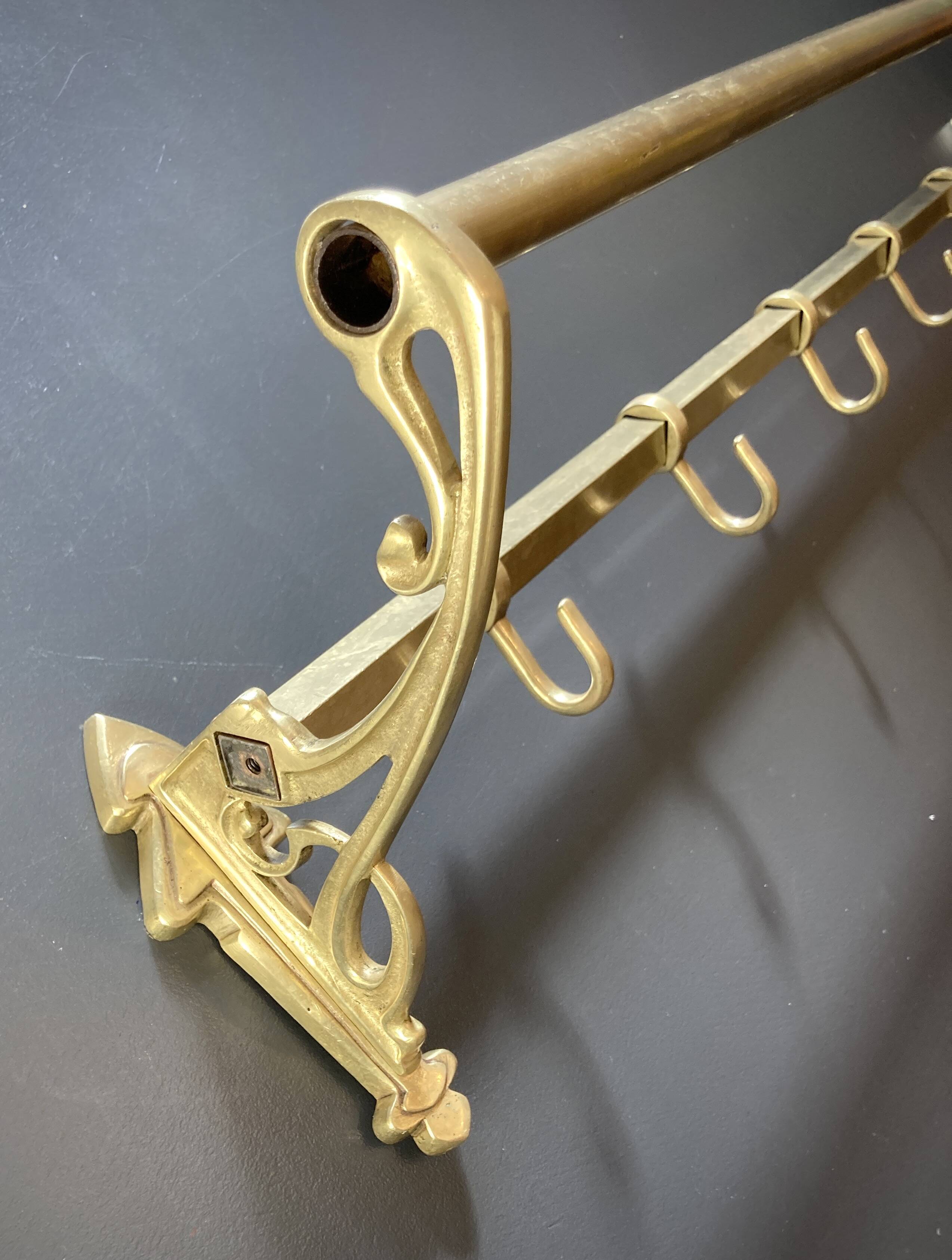 Art-deco wall-mounted coat rack in brass
