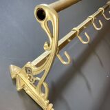 Art-deco wall-mounted coat rack in brass