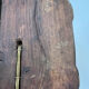 Sculpted wooden lamp with faces, antique.