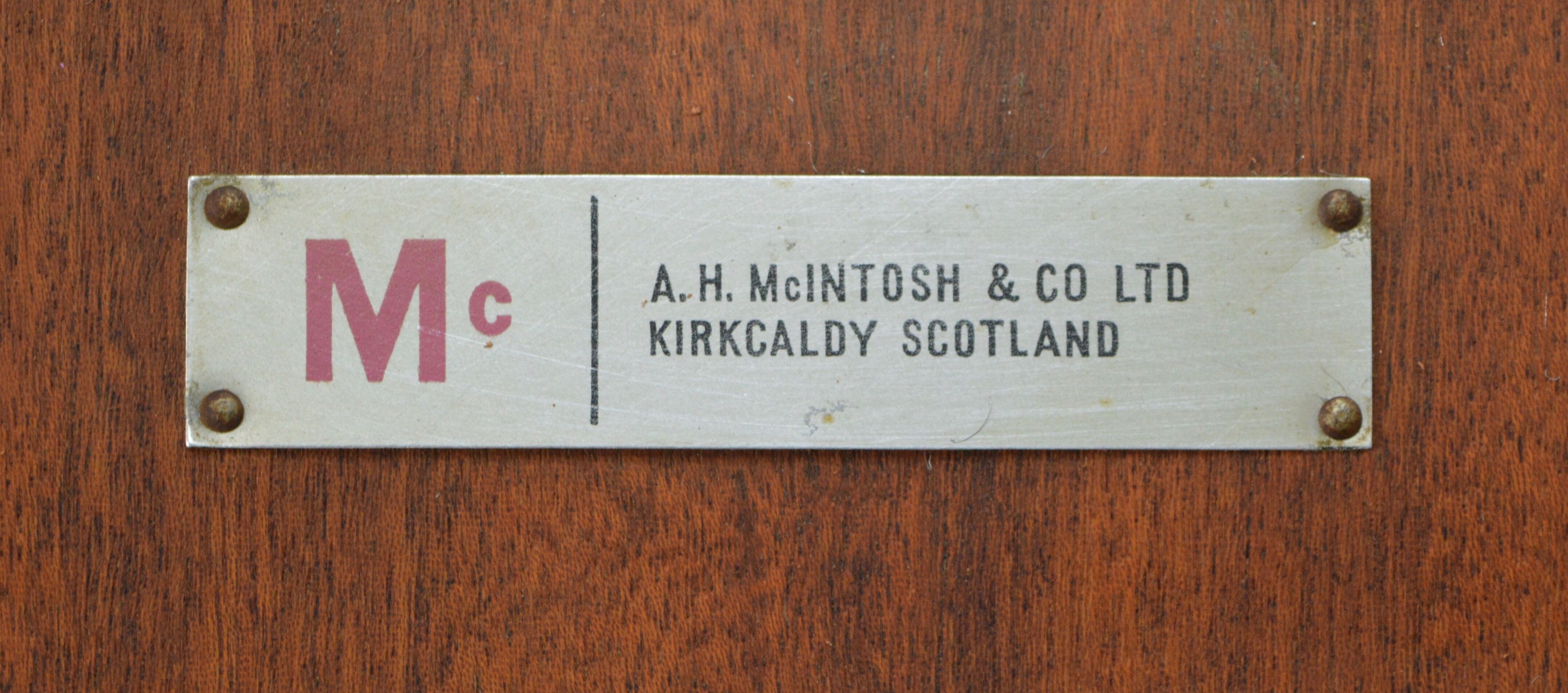 Round teak dinning table and chairs by Mctintosh