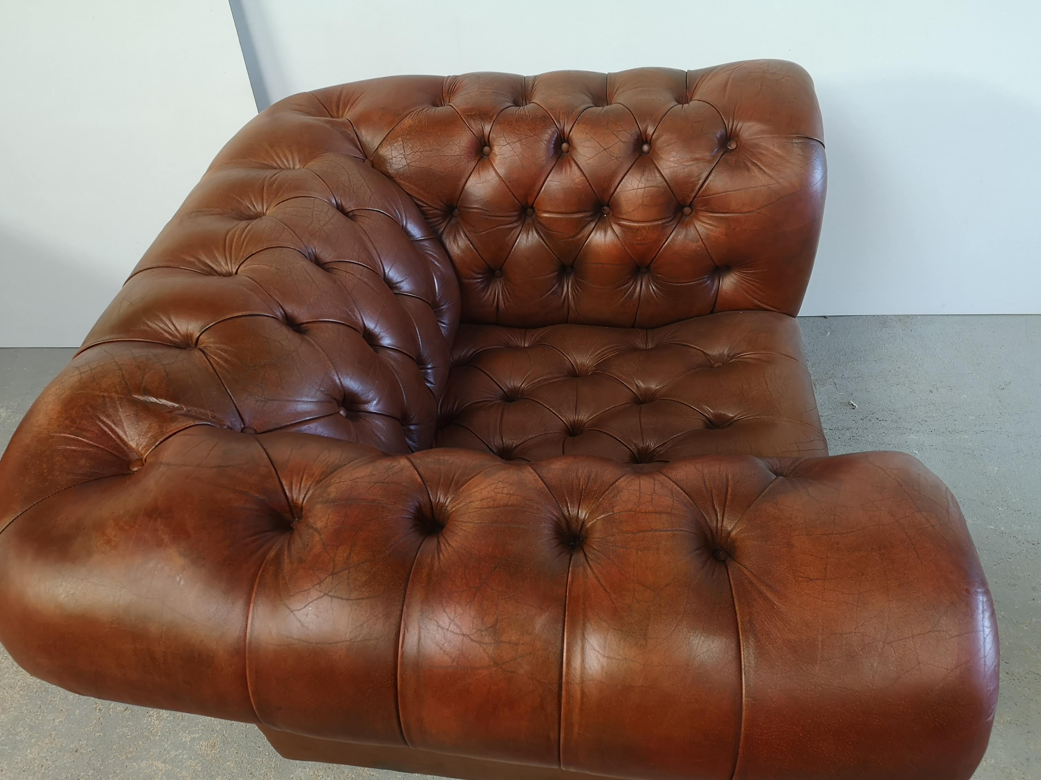 Brown leather chesterfield armchair