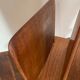 Magazine rack, in oak, by Pierre Cruège